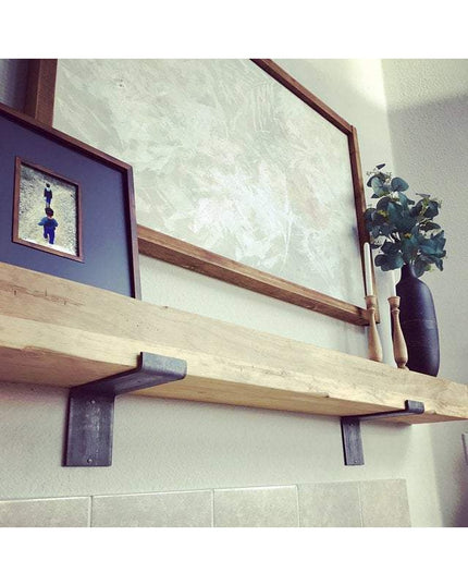 Industrial Farm Co Skaneateles Z Style black metal shelf brackets supporting natural wood floating shelf on white wall
