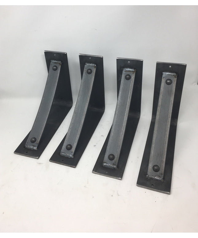 Four black metal Troy Shelf Support brackets by Industrial Farm Co with welded reinforcement bars and mounting holes displ...