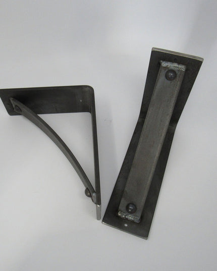 Black metal Troy Shelf Support brackets by Industrial Farm Co showing triangular wall mount design with mounting holes on ...