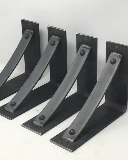 Four black metal Troy Shelf Support brackets by Industrial Farm Co with welded reinforcement bars and mounting holes arran...