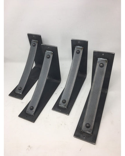 Four black metal Troy Shelf Support brackets by Industrial Farm Co arranged on white surface, showing L-shaped design with...