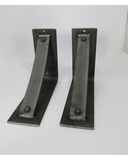 Pair of dark metal Troy Shelf Support brackets by Industrial Farm Co, featuring L-shaped design with mounting holes on whi...