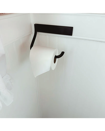 Howlett Hill black metal toilet paper holder mounted on white wainscoting bathroom wall by Industrial Farm Co