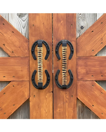 Bermuda Horseshoe Door Handle with black leather wrap mounted on rustic cedar barn doors by Industrial Farm Co