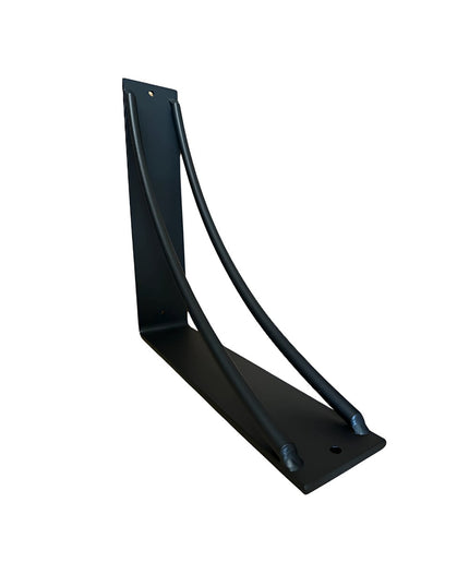 Black metal Sawmiller Shelf Bracket by Industrial Farm Co with curved support design and mounting holes on white background
