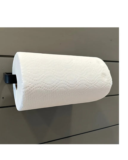Black metal Jordan Paper Towel Holder by Industrial Farm Co mounted on gray wood slat wall holding white paper towels