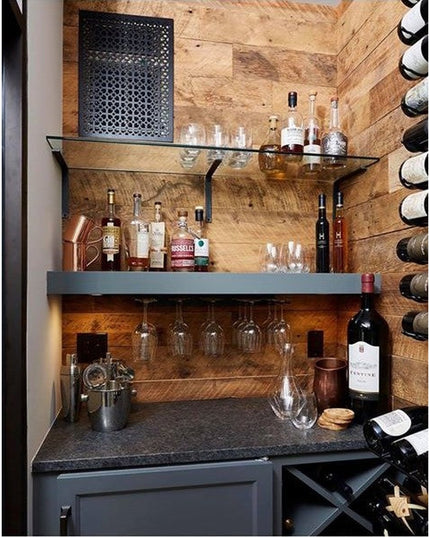 White Plains Wine Glass Rack by Industrial Farm Co mounted under wooden shelf in rustic home bar with wine bottles and spi...