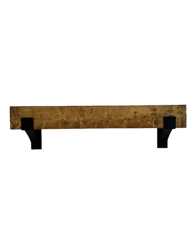Rustic wooden mantel shelf with black steel bracket supports from Industrial Farm Co, showing natural wood grain and weath...