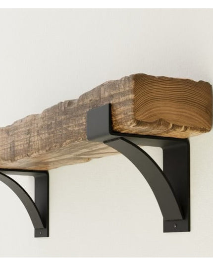 Kudlick Farmhouse Mantel Bracket by Industrial Farm Co featuring black metal corbels supporting natural wood beam with vis...