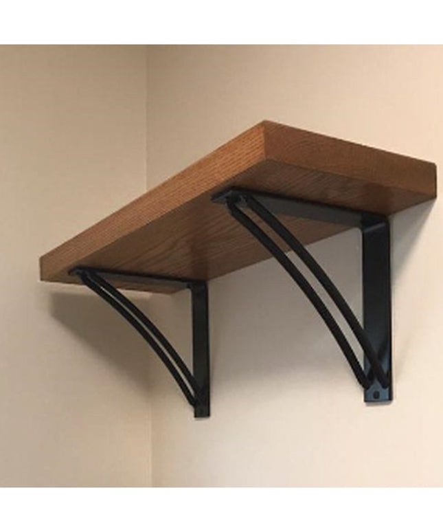 The Niagara Bracket Support by Industrial Farm Co - black metal triangular shelf brackets supporting wood shelf on wall