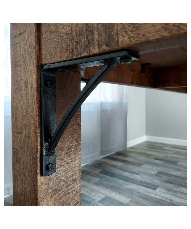 Black steel Oak Hill 1" Industrial Shelf Bracket with curved support bar mounted on rustic wood beam, handmade heavy duty ...