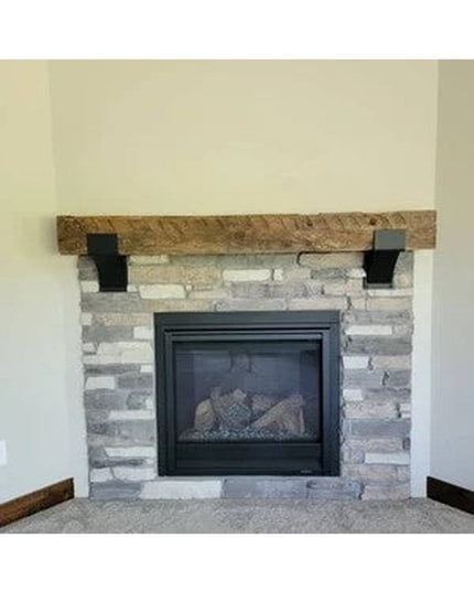 Rustic wood Norfolk Farmhouse Brackets by Industrial Farm Co supporting wooden mantel above stone fireplace, showing farmh...