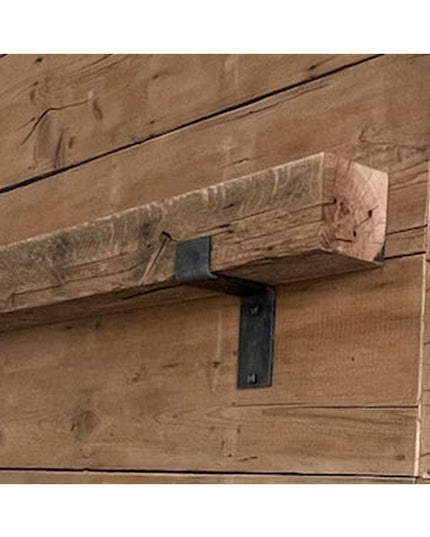 Skaneateles Z Style black metal shelf bracket mounted under rustic wood beam showing Industrial Farm Co support hardware