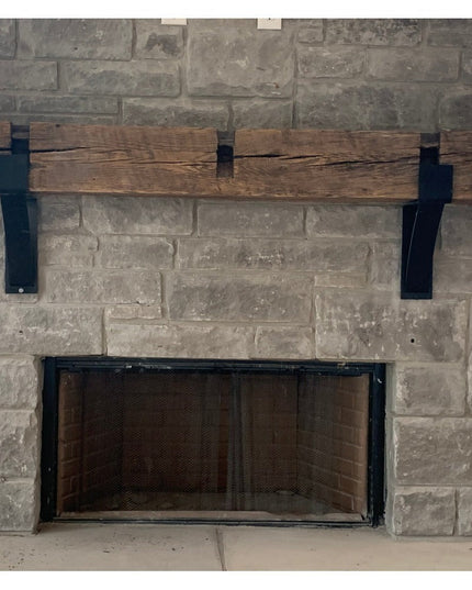 Vandiver Evergreen Tree Mantel End Caps by Industrial Farm Co - black metal brackets supporting rustic wood beam mantel on...
