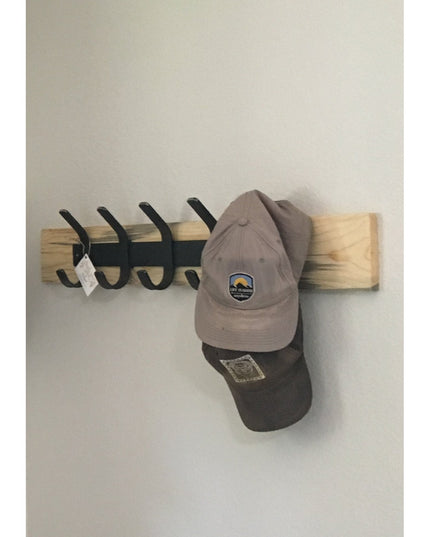 Wall-mounted Christopher Double Hook Coat Rack by Industrial Farm Co with natural wood base, black metal hooks, and two ba...