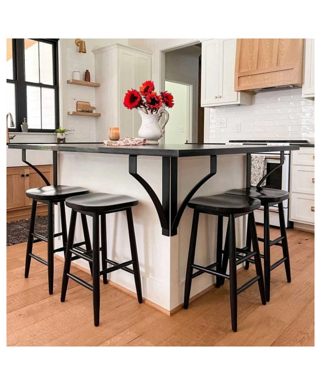 Black metal Syracuse countertop support brackets by Industrial Farm Co holding up dark kitchen island with bar stools in m...