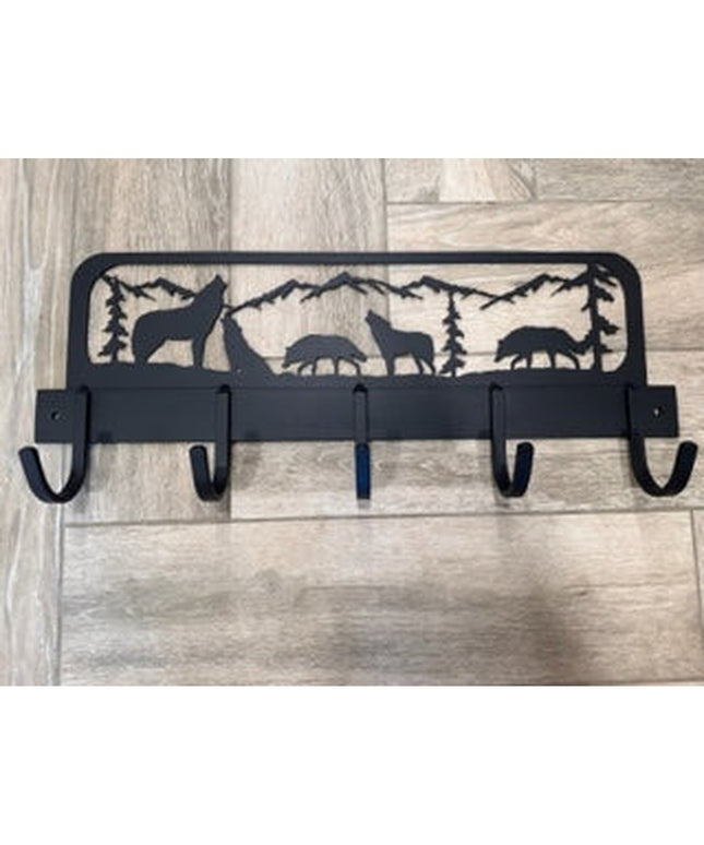 Black metal wall-mounted coat rack featuring wolf and wildlife silhouettes with mountain landscape design, 5 hooks by Indu...