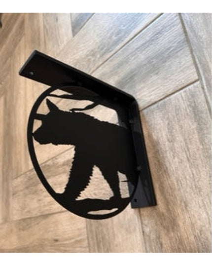 Black metal L-bracket shelf support with bear silhouette cutout design on wood grain background - Industrial Farm Co handc...